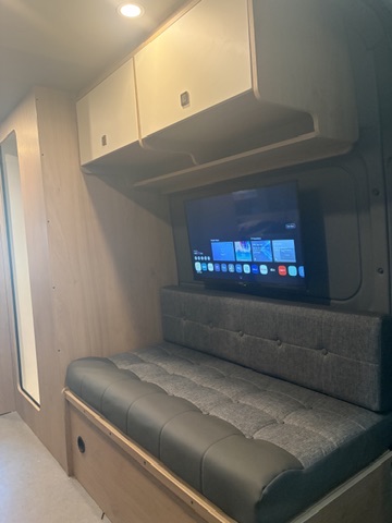 Bossway Origin rear lounge — wall-mounted TV and premium upholstery