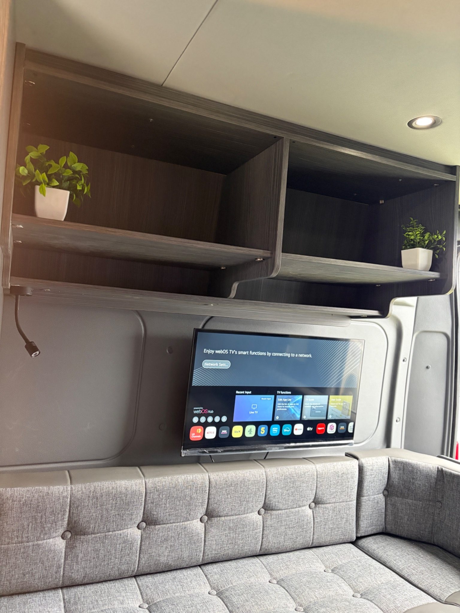 Bossway Adventure campervan rear lounge with TV